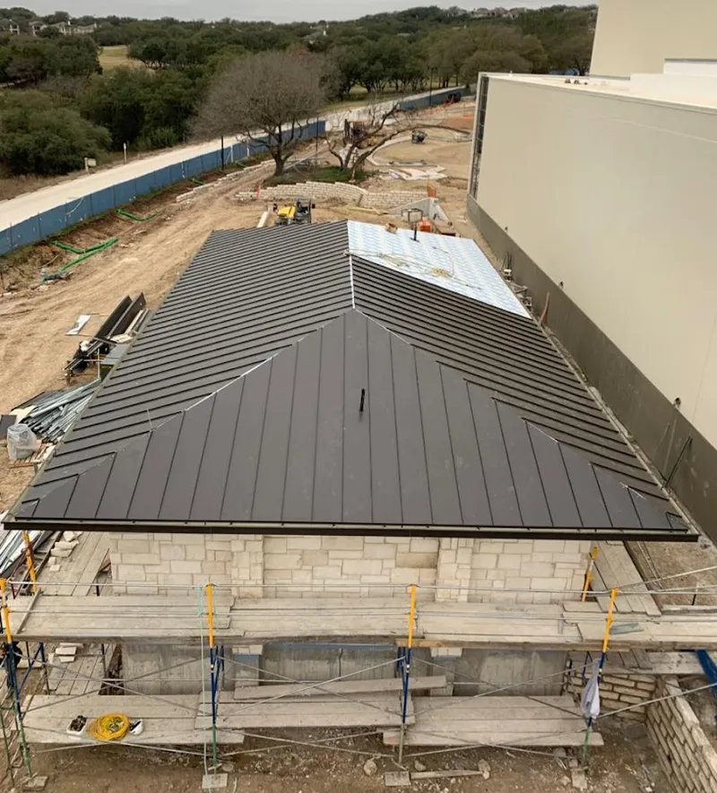 Metal roof new construction with scaffolding in Chalco